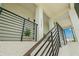 Modern home with sleek black metal railings and a stylish entryway at 7949 2Nd S Ave, St Petersburg, FL 33707