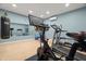 Home gym with Peloton bike and various other exercise equipment at 7949 2Nd S Ave, St Petersburg, FL 33707