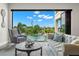 Living room with water view, comfortable seating, and stylish decor at 7949 2Nd S Ave, St Petersburg, FL 33707