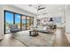 Living room with hardwood floors and sliding glass doors to the pool area at 7949 2Nd S Ave, St Petersburg, FL 33707