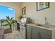 Modern outdoor kitchen with stainless steel appliances and granite countertops at 7949 2Nd S Ave, St Petersburg, FL 33707