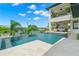 Luxury pool and patio area showcasing modern design and waterfront access at 7949 2Nd S Ave, St Petersburg, FL 33707