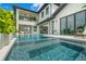 Stunning pool with modern design, offering water features and a relaxing view at 7949 2Nd S Ave, St Petersburg, FL 33707