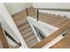 Modern staircase with wood and metal accents at 7949 2Nd S Ave, St Petersburg, FL 33707