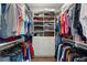 Large walk-in closet with ample shelving and hanging space at 7949 2Nd S Ave, St Petersburg, FL 33707