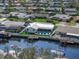 Wide aerial view of a waterfront neighborhood with canal access and private docks for residents at 1367 51St Ne Ave, St Petersburg, FL 33703