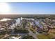 Aerial view of waterfront home with private dock, lush landscaping, and waterway access at 1367 51St Ne Ave, St Petersburg, FL 33703