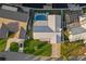 Overhead aerial of property, showing pool, lush green lawn, canal and boat dock at 1367 51St Ne Ave, St Petersburg, FL 33703