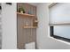 Stylish bathroom detail with floating shelves, wood paneling, and elegant decor at 1367 51St Ne Ave, St Petersburg, FL 33703