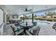 Covered patio with dining area overlooking the pool and canal at 1367 51St Ne Ave, St Petersburg, FL 33703