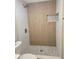 Updated bathroom with wood-look tile shower surround at 5980 80Th N St # 106, St Petersburg, FL 33709