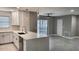 Open concept kitchen with island and stainless steel appliances at 5980 80Th N St # 106, St Petersburg, FL 33709