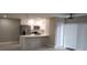 Modern kitchen with white cabinets, quartz countertops and gold fixtures at 5980 80Th N St # 106, St Petersburg, FL 33709