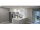 Modern kitchen with white cabinets and quartz countertops at 5980 80Th N St # 106, St Petersburg, FL 33709