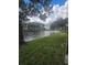 Scenic view of a tranquil lake and lush green landscape at 5980 80Th N St # 106, St Petersburg, FL 33709