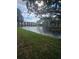 Peaceful lakefront view with fountain and lush landscaping at 5980 80Th N St # 106, St Petersburg, FL 33709