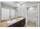 Bathroom with double vanity and a separate tub and shower at 8277 Bower Bass Cir, Wesley Chapel, FL 33545