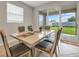 Bright dining area with sliding glass doors leading to the backyard at 8277 Bower Bass Cir, Wesley Chapel, FL 33545