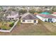 Aerial view showing home's backyard, surrounding houses, and neighborhood landscape at 10918 Ancient Futures Dr, Tampa, FL 33647