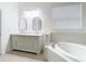 Bathroom boasts a large soaking tub and double vanity at 10918 Ancient Futures Dr, Tampa, FL 33647