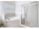 Bathroom with bathtub, shower, and tile flooring at 10918 Ancient Futures Dr, Tampa, FL 33647