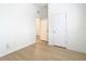 White walls and light wood floors. Room has two doors at 10918 Ancient Futures Dr, Tampa, FL 33647