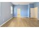 Bedroom with light blue walls and wood floors at 10918 Ancient Futures Dr, Tampa, FL 33647