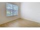 Well-lit bedroom featuring wood-look floors and a large window with blinds at 10918 Ancient Futures Dr, Tampa, FL 33647