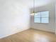 Bright dining room with light wood floors and a chandelier at 10918 Ancient Futures Dr, Tampa, FL 33647