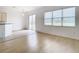 Dining area with wood-look floors and view to backyard at 10918 Ancient Futures Dr, Tampa, FL 33647