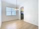 Bright dining area with chandelier and window overlooking backyard at 10918 Ancient Futures Dr, Tampa, FL 33647