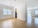 Dining room with chandelier and kitchen access at 10918 Ancient Futures Dr, Tampa, FL 33647