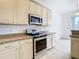 Kitchen features stainless steel appliances and light cabinets at 10918 Ancient Futures Dr, Tampa, FL 33647