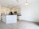 Kitchen features an island and light-colored cabinets at 10918 Ancient Futures Dr, Tampa, FL 33647