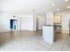 Open kitchen with island and light cabinetry at 10918 Ancient Futures Dr, Tampa, FL 33647