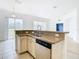 Kitchen with double sink and stainless steel dishwasher at 10918 Ancient Futures Dr, Tampa, FL 33647