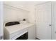 Laundry room with washer, dryer, and shelving at 10918 Ancient Futures Dr, Tampa, FL 33647