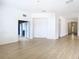 Bright living room with wood-look floors and open floor plan at 10918 Ancient Futures Dr, Tampa, FL 33647