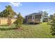 Newly built home with a backyard and deck at 1518 E Knollwood St, Tampa, FL 33610