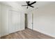 Well-lit bedroom with wood-look floors and ample closet space at 1518 E Knollwood St, Tampa, FL 33610