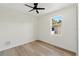 Spacious bedroom with a large window and wood-look floors at 1518 E Knollwood St, Tampa, FL 33610