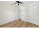 Light-filled bedroom with wood-look floors and ample closet space at 1518 E Knollwood St, Tampa, FL 33610