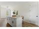 Modern kitchen island with white cabinets and quartz countertops at 1518 E Knollwood St, Tampa, FL 33610