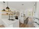 Modern kitchen with white cabinets and a large island at 1518 E Knollwood St, Tampa, FL 33610