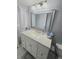 Clean bathroom featuring a white vanity and hexagon tile floor at 3600 Magnolia Ridge Cir # 1221-G, Palm Harbor, FL 34684