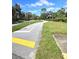 Paved walking path with green space on either side at 3600 Magnolia Ridge Cir # 1221-G, Palm Harbor, FL 34684