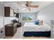 Main bedroom with king bed, built-in desk, and golf course view at 1120 North Shore Ne Dr # 201, St Petersburg, FL 33701