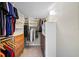 Large walk-in closet with ample shelving and drawers at 1120 North Shore Ne Dr # 201, St Petersburg, FL 33701