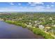 Waterfront houses with lush surroundings and water views fill this stunning aerial view of the area at 6231 Bayshore Blvd, Tampa, FL 33611