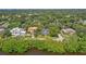 Aerial view of the house on a lush, green waterfront property with stunning landscape and waterfront views at 6231 Bayshore Blvd, Tampa, FL 33611